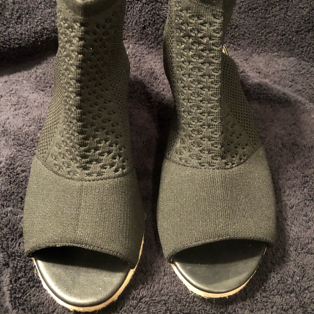 Women’s black wedge sandals.